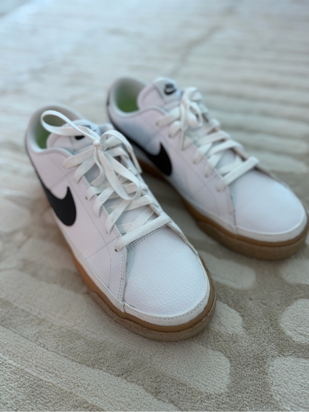 Nike White Leather Sneakers with Black Swoosh and Gum Sole